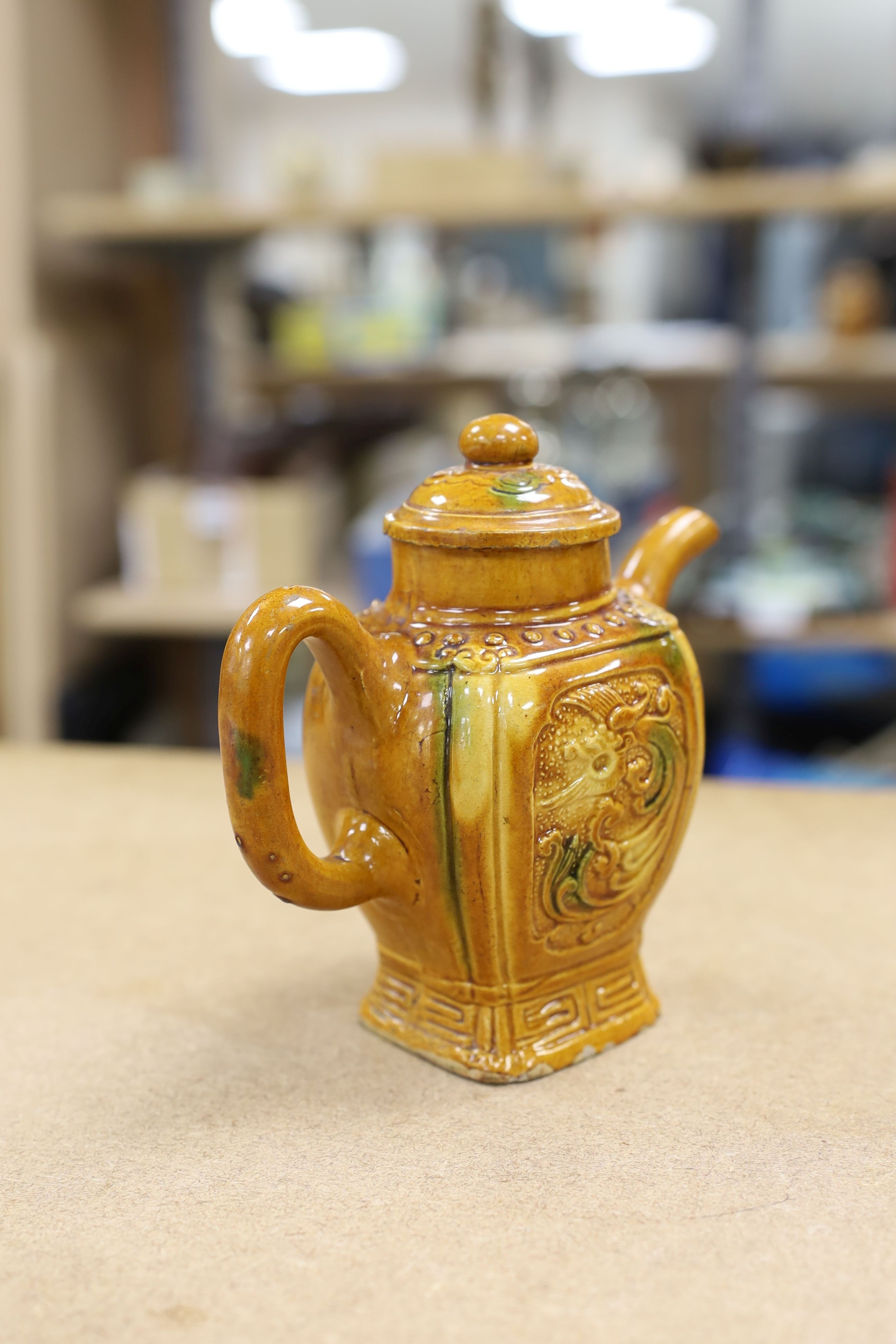 A Chinese enamelled yellow-ground jar and cover, a pottery teapot and cover and a flambe vase, latter 13cm